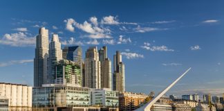 How will Argentina achieve universal access to water and sanitation?